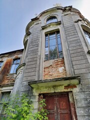 ZHELUDOK, BELARUS - SEPTEMBER 12, 2020: The abandoned manor of Svyatopolk-Chetvertinsky, built in the early 20th century. Popular tourist attraction in Belarus - 385609698