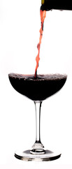 red wine pouring into glass