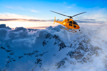 Yellow Helicopter flying over the Rocky Mountains during a colorful sunset. Aerial Landscape from British Columbia, Canada near Vancouver. Epic Adventure Composite © edb3_16