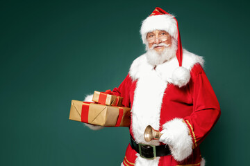 Good old Santa Claus holding gift boxes.