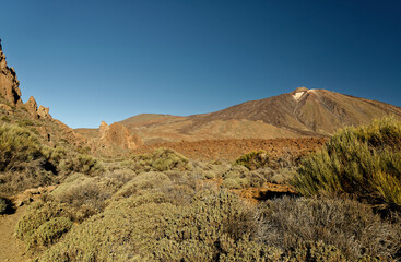 Landscape from Tenerife Canary Islands, view to the volcano Pico del Teide, deserts and semi-deserts in the dry mountains. Blue sky, rocky and vulcanic surface