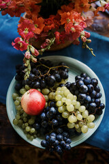 Assortment of fruits on table. Ripe grapes, pear and peaches .
