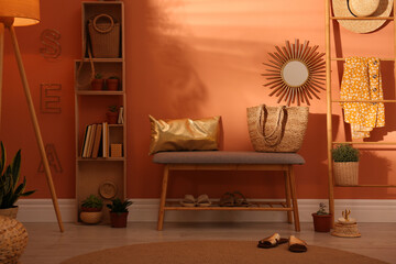 Beautiful room interior with stylish furniture near brown wall