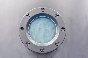 Closeup of muffle furnace equipment in pharma or chemical manufacturing plant or industry. Pill maker porthole window