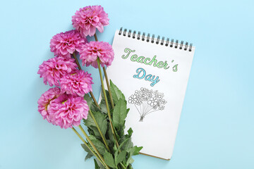 Beautiful flowers and notebook with words TEACHER'S DAY on light blue background, flat lay