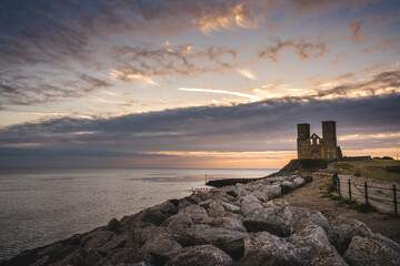 Remains of Reculver church towers at early october sunrise  early october sunrise