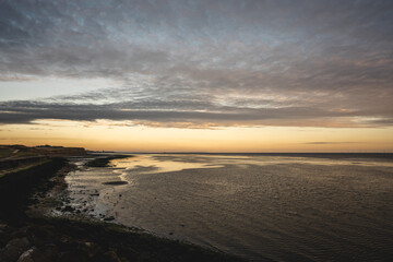 Remains of Reculver church towers at early october sunrise  early october sunrise