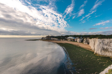 Empty Kingsgate Beach and Castle on the cliffs above the Bay, on cloudy autumn morning.