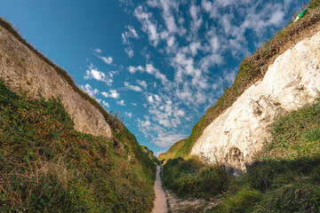 Empty Kingsgate Beach, walking through the chalk stacks clifs at Botany Bay in Kent, England.