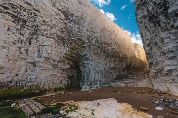 Empty Kingsgate Beach, walking through the chalk stacks clifs at Botany Bay in Kent, England.
