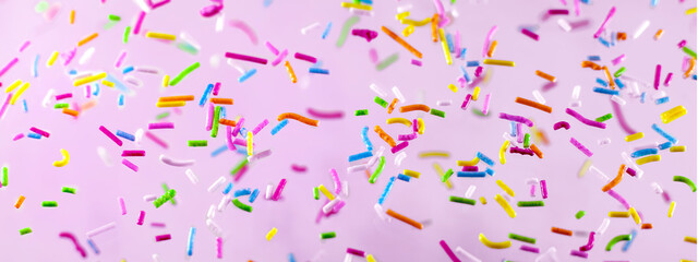 Abstract bright holiday background.Multicolored splashes. Decoration for confectionery, topping.Food background panorama