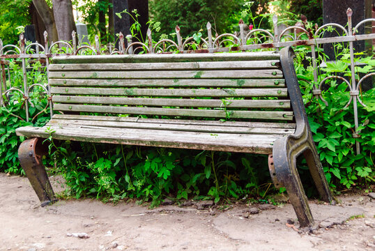 An old wooden bench in Lychakiv cemetery, Lviv, Ukraine