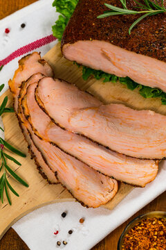 Roasted Turkey Breast Cajun Style Deli Lunch Meat on Old Wooden Background. Selective focus.