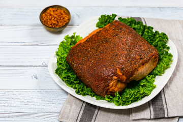 Roasted Turkey Breast Cajun Style Deli Lunch Meat on Old Wooden Background. Selective focus.