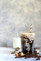 Homemade delicious iced coffee or frappe in a tall glass.