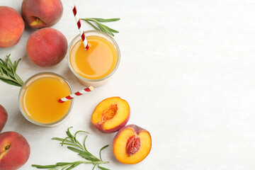 Natural freshly made peach juice on white table, flat lay. Space for text