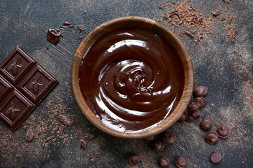 Homemade chocolate ganache in a wooden bowl . Top view with copy space.