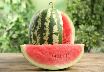 Tasty ripe cut watermelon on wooden table