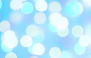 blue bokeh background.
Delicate abstract background with bokeh on blue with white circles, close-up.