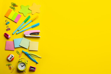 School stationery on yellow background, flat lay with space for text. Back to school