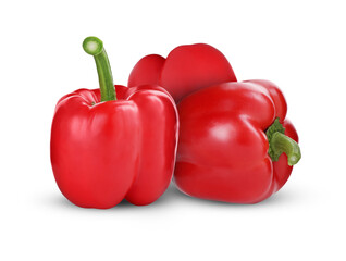 Three whole red bell peppers on white background