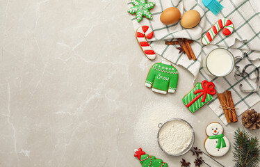 Flat lay composition with delicious homemade Christmas cookies on grey marble table. Space for text