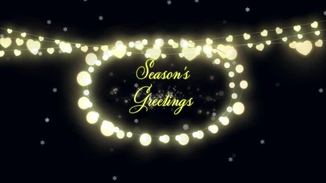 Seasons Greetings text and fairy lights against glowing spots on black background