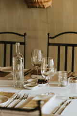 rustic table - plates and cutlery - crockery and glasses
