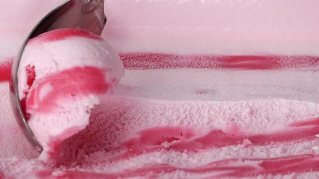 steel ice cream scoop scooping vanilla flavor ice cream meat.
