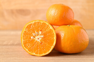Fresh Honey Murcott orange fruit on wooden background