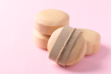 Tamarind soap on pink background, organic natural product for skin care