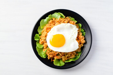 Korean food, Kimchi fried rice with fried egg on top on white background, Top view