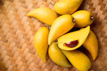 Eggfruit or canistel on bamboo tray, Thai fruit, In Thai names such as Xiantao, Lamut Khamen or Mon khai