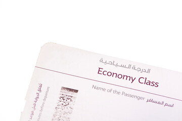 Close up of economy class boarding pass English and Arabic langauge with empty space