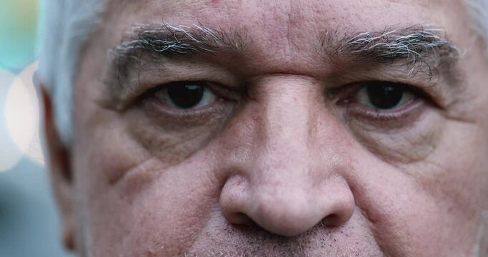 Serious Old wrinkled middle-aged man eyes close-up
