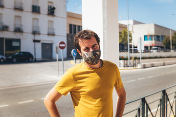 man with a mask standing on the street