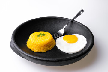 Brazilian Northeast Couscous (Cuscuz Nordestino). Maize couscous on white background