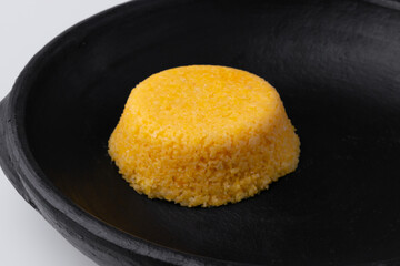 Brazilian Northeast Couscous (Cuscuz Nordestino). Maize couscous on white background