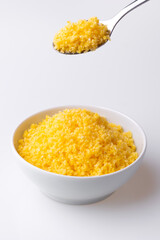 Brazilian Northeast Couscous (Cuscuz Nordestino). Maize couscous on white background