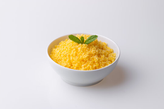 Brazilian Northeast Couscous (Cuscuz Nordestino). Maize couscous on white background