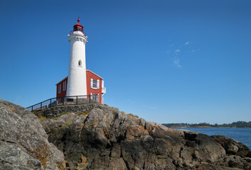 Fototapeta na wymiar Fisgard Lighthouse British Columbia. Historic Fisgard Lighthouse located near Victoria, British Columbia overlooking the Strait of Juan de Fuca.