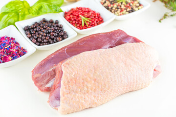 Christmas raw duck Brest with Herbst on white background