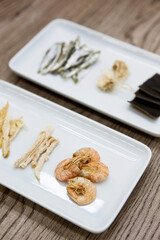 Dried ingredients on wooden table
