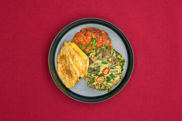 Korean food, korean pancake (Pajeon,Kimchi-jeon and Pollack pancake) on red background.