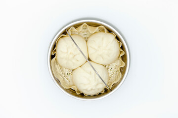 Big size dumplings in steamer.