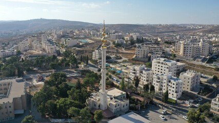 Golden Mosque Tower Minaret in Beit Hanina, Aerial view
Palestinian Muslim Mosque Masjed aldaoa, Drone image
