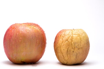 Variegated fresh and wrinkled apples a metaphor for aging. Concept of skin care and freshness