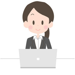 笑顔でノートパソコンを操作をするビジネスウーマン