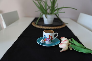 Turkish coffee wit black background and tulips