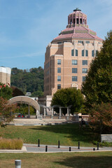 Asheville City Hall is seen at a distance from Pack Square. 